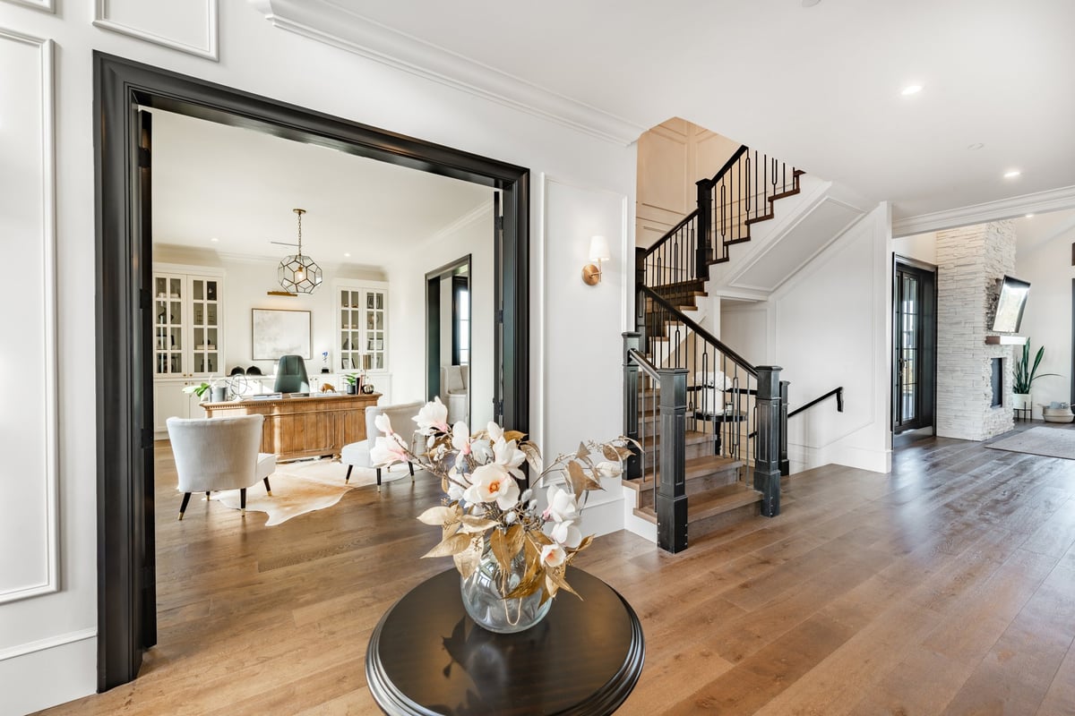 Luxurious estate home entryway with grand staircase