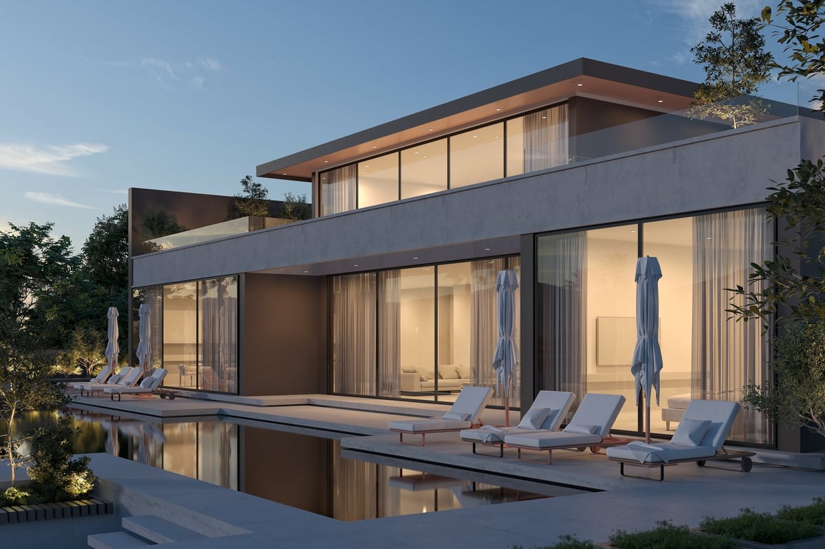 Luxury modern home exterior with pool at golden hour