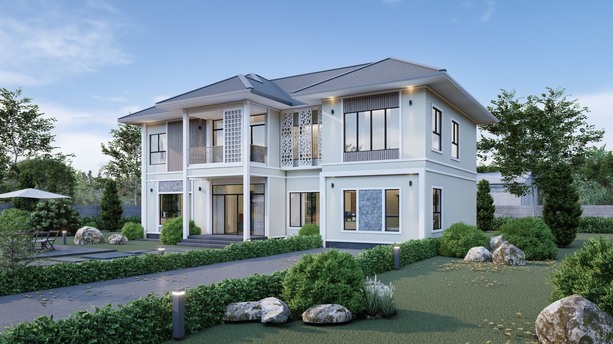 Modern two-story house with lush garden and driveway